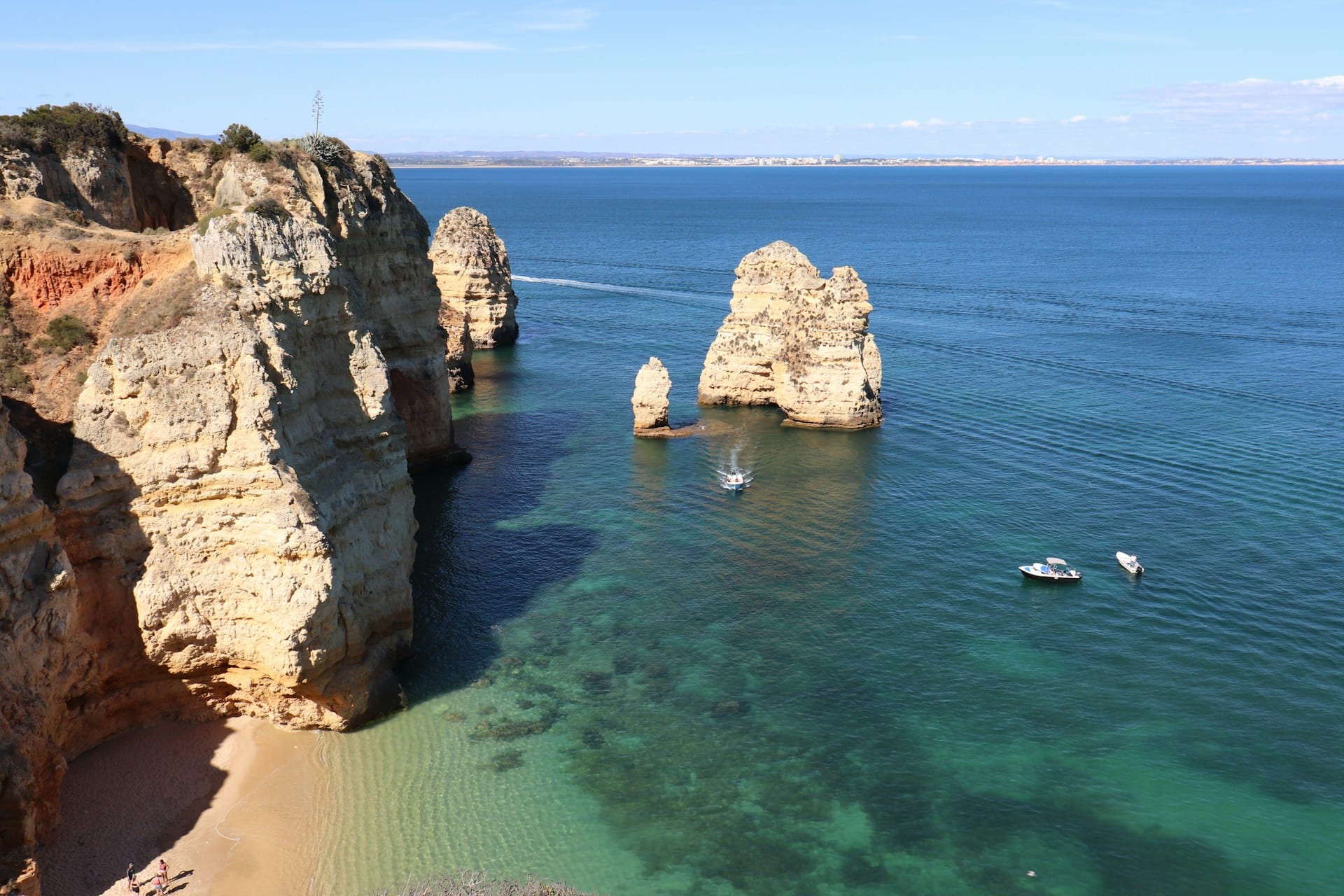 Scenic view of the Algarve coastline and limestone sea caves from the ocean in Lagos Portugal