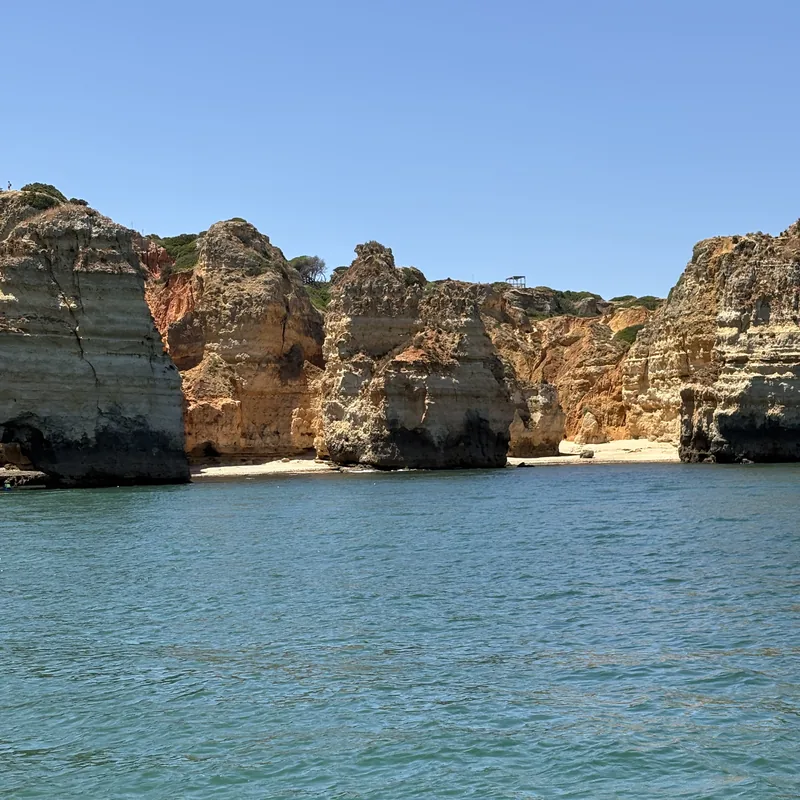 Golden limestone cliffs and a hidden beach at Ponta da Piedade, Lagos
